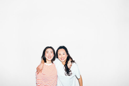 Two Asian Women Posing in Studio