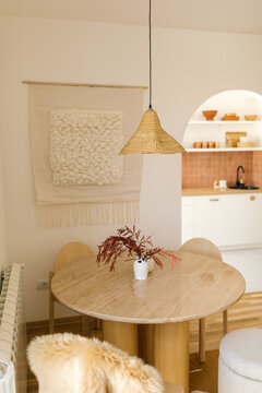 Wooden dining room table with chair and stool