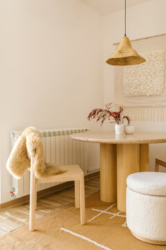 Wooden dining room table with chair and stool