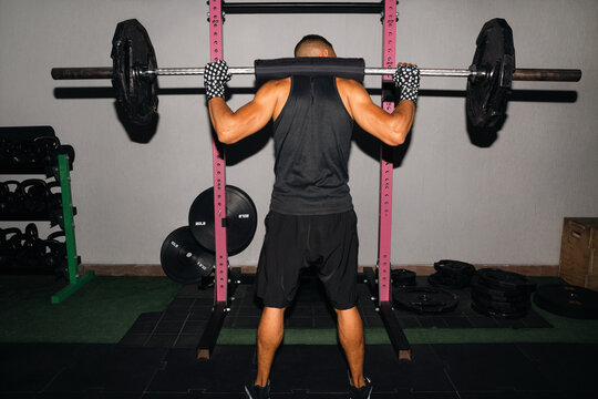 Man Lifting A Barbell In gym