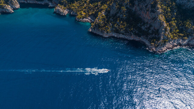 top-down view of speed boat in blue water