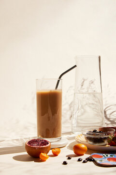 Glass of iced latte with a straw