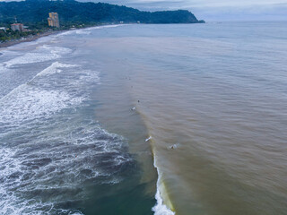 Beautiful aerial view of Surfers in Hermosa Beach - Jaco in Costa Rica