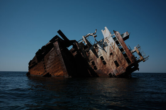 Rusty Shipwreck In The Sea