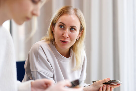 Girl having conversation with acquaintance