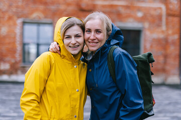 Portrait of Ukrainian refugees in patriotic coats 