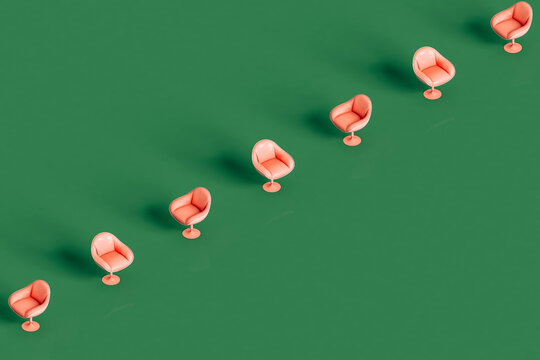 a row of pink armchairs