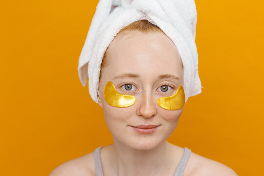 Woman Using yellow Under-Eye Patches on yellow background