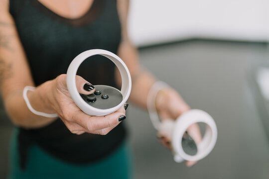 Woman wearing VR goggles touching air 