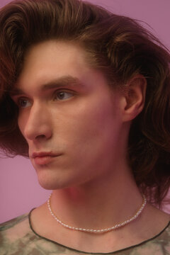 Crop-portrait of young androgynous man