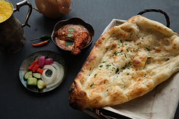 Butter Chicken and Garlic Naan with Mango Lassi
