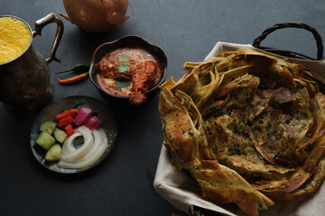 Butter Chicken and Garlic Naan with Mango Lassi