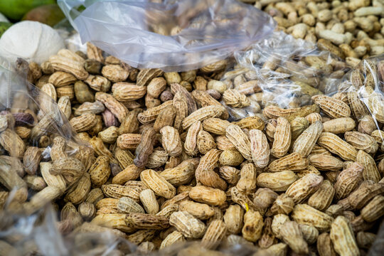 Unshelled peanuts for sale at a market in Thailand