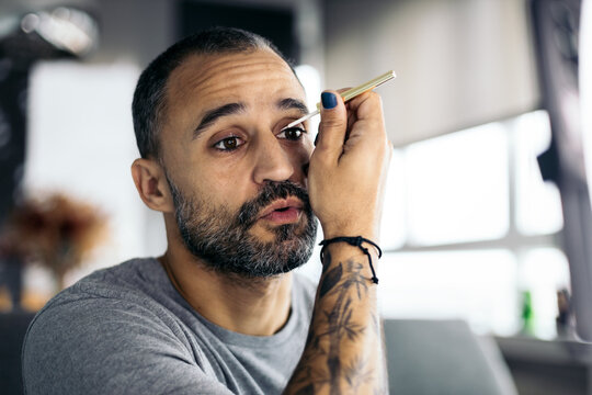 Modern Man Putting On Makeup