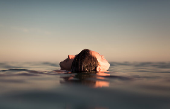 Lovers floating together on the empty sea