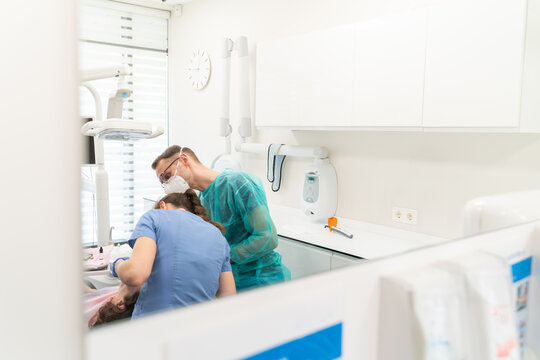 Dentists Working At Dental Clinic