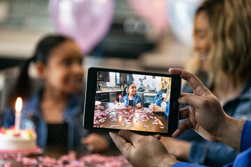Dad Taking A Photo Of Girl With Birthday Cake