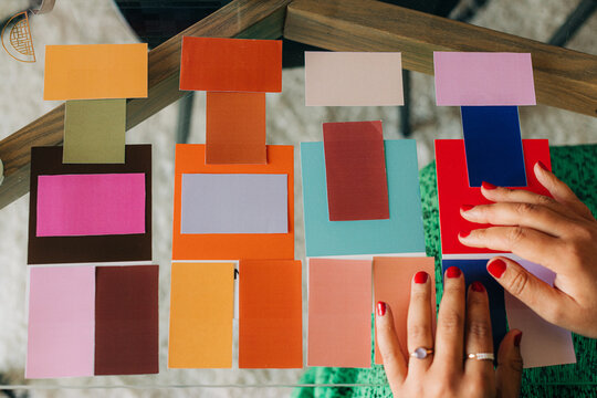 Female designer matching color samples