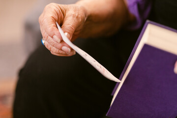 Crop old lady with astrological chart