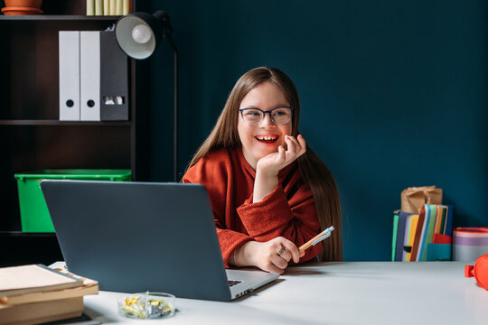 Girl with Down Syndrome Using Laptop 