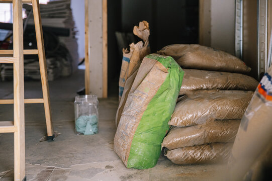 Renovation supplies stacked on floor