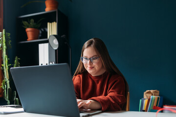 Girl with Down Syndrome Using Laptop 