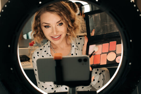 Female beauty blogger with a blusher pallette