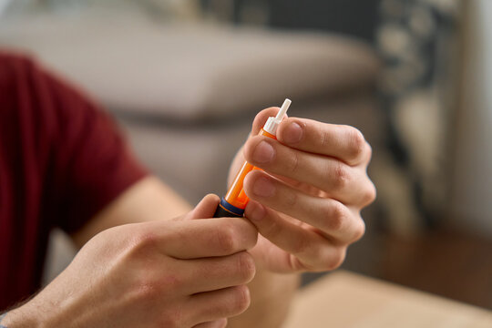 man with diabetes takes a finger blood test and does a routine home