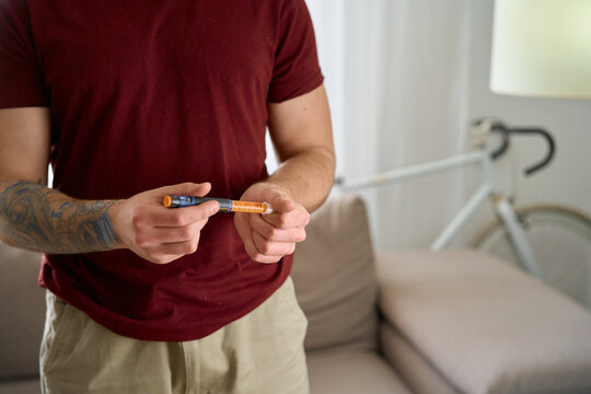 man with diabetes takes a finger blood test and does a routine home