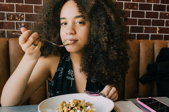 woman Eating In Restaurant