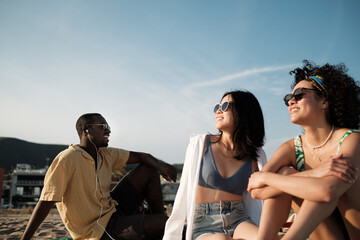 Friends sunbathing on the beach