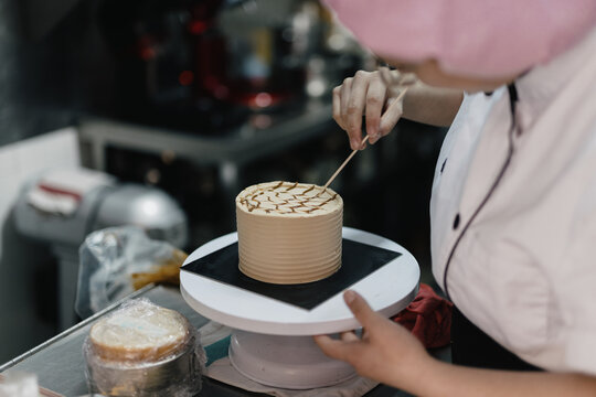 Young girl baking cakes 