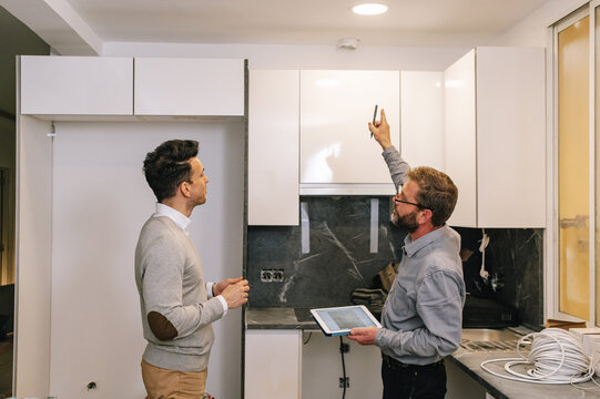 Interior designer discussing kitchen with client