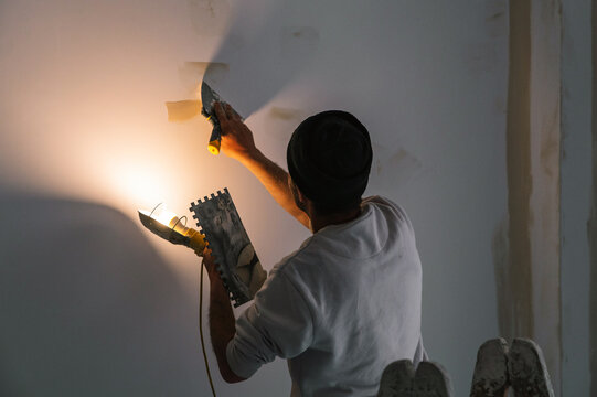 Interior designer fixing for painting wall