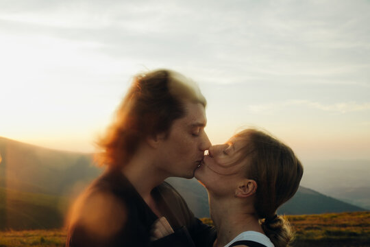 &nbsp;Kiss of lovers at sunset in the mountains