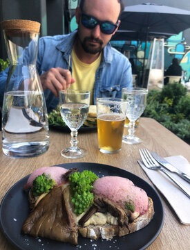 UGC mand having lunch at the vegan restaurant
