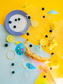 Bright summer still life with banana and blueberry.
