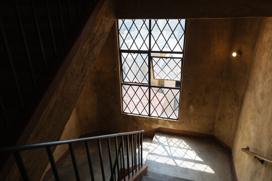 Elaborate metal framed window in stairwell