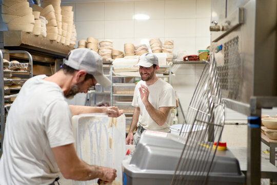 Baker team working in professional kitchen