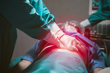 Medical team saving people life in hospital. Doctor first aid emergency CPR patient heart failure.