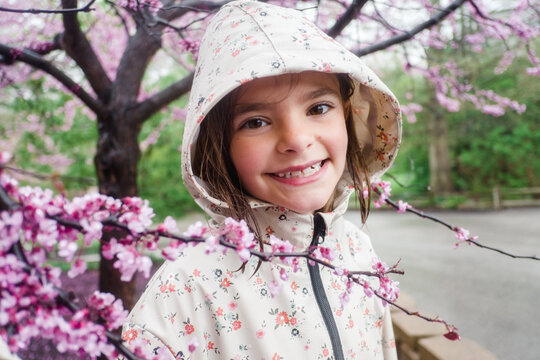 portrait of smiling girl in raincoat
