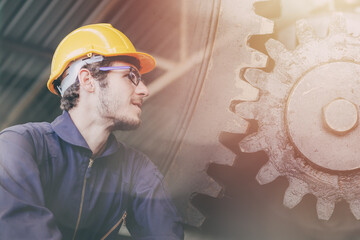 Caucasian Engineer staff worker working overlay with metal gear cogwheel for people run industry...