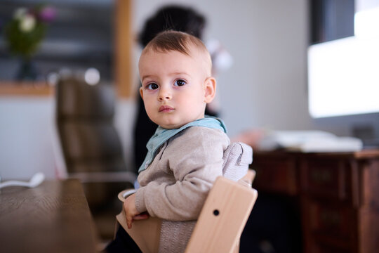 Toddler sitting on chair