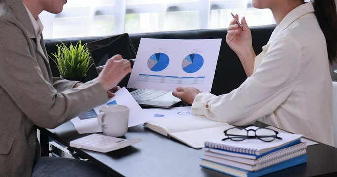 Team of business people are meeting to analyze data for marketing plan,Market research reports and income statistics, Financial and Accounting concept.
