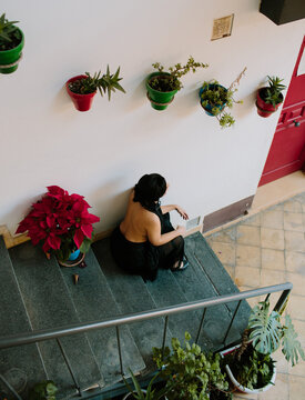 Half naked woman sitting in stairs