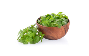fresh mint leaves in wooden bowl isolated on white background