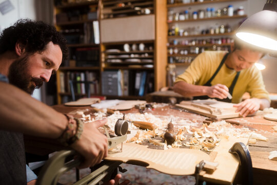 Violin luthiers during intese work session