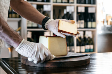 Holding A Slice Of Applewood Smoked Cheddar Cheese