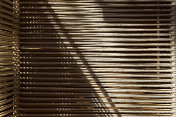 Closeup of the textures of a fabric made with beige macrame