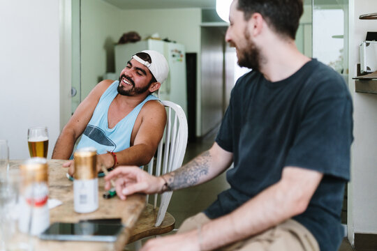 Man having beers with friends at home